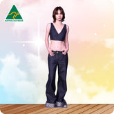 Woman wearing a black top and blue jeans on a colorful background with 'Australian Made' logo.